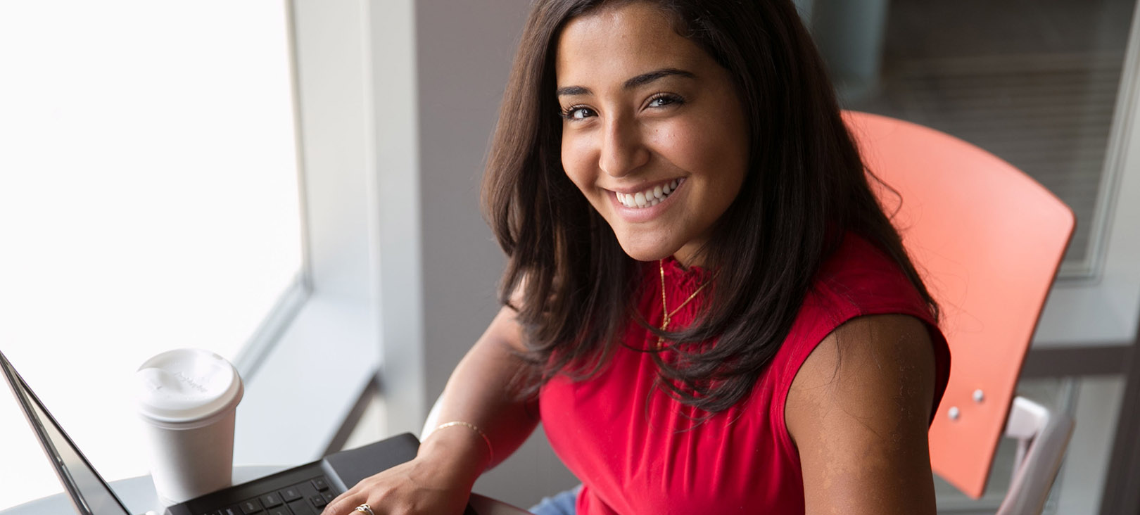 Graduate Programs A female student smiling toward the camera.jpg
