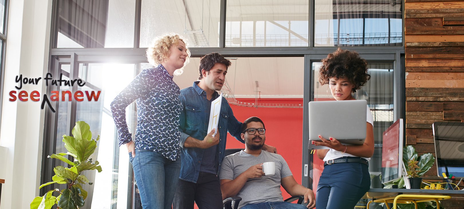 Graduate Degree: Business and Leadership (MBA, M.A.) A group of students looking at a laptop held by a woman.jpg