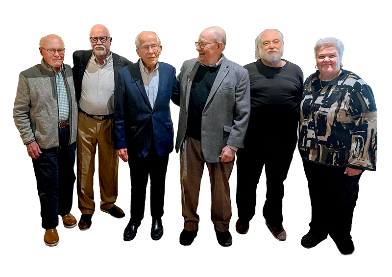 Group of six elderly individuals posing together, showcasing a diverse range of attire and expressions.