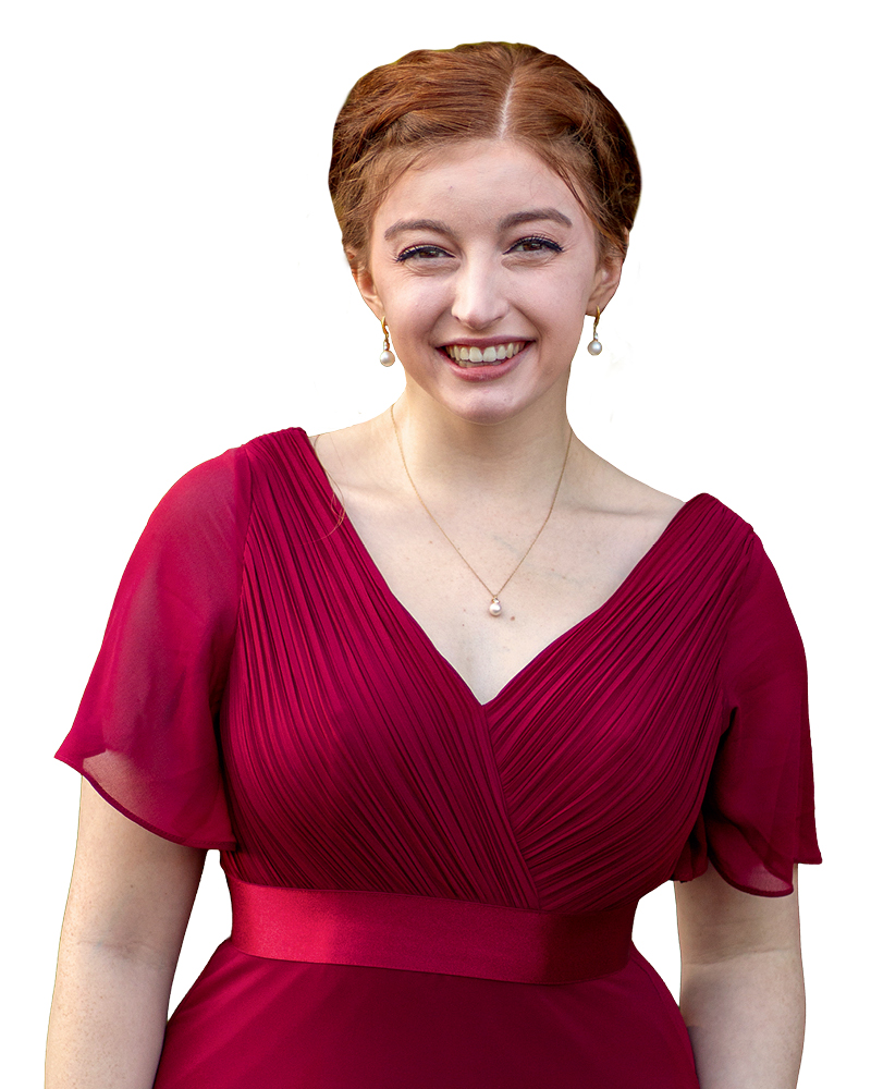 Young woman smiling in a deep burgundy dress with a pleated design and short sleeves.