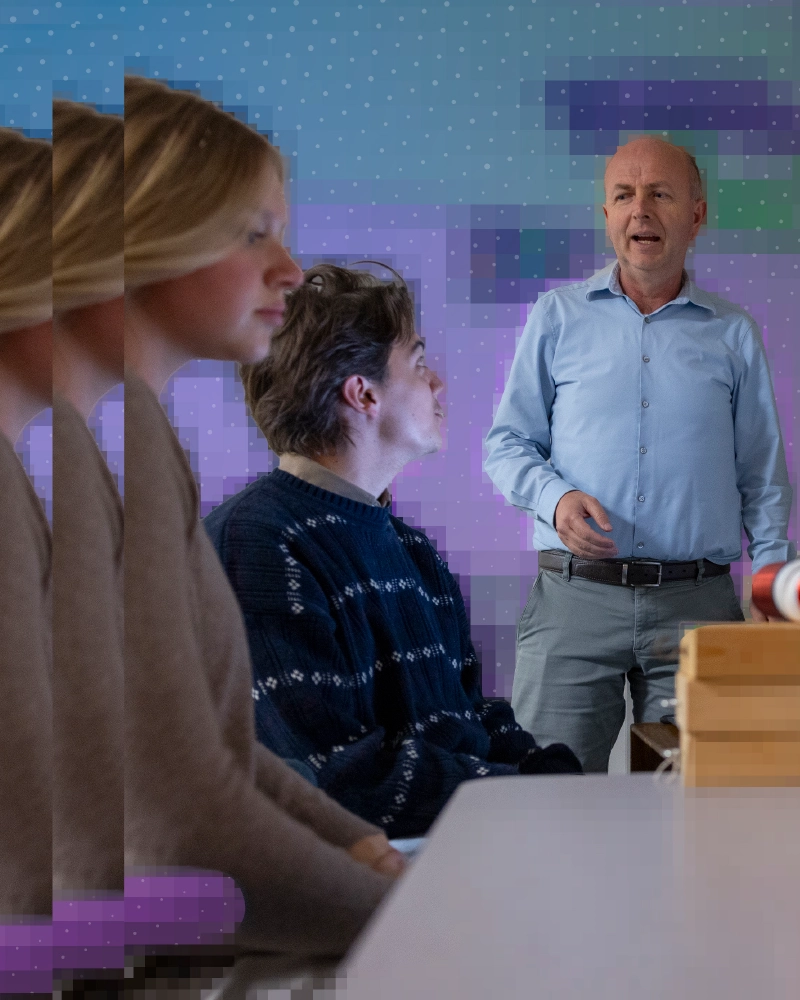 Professor of Physics Abaz Kryemadhi with Franklin Kelly ’27 and Zoë Prettyman ’27