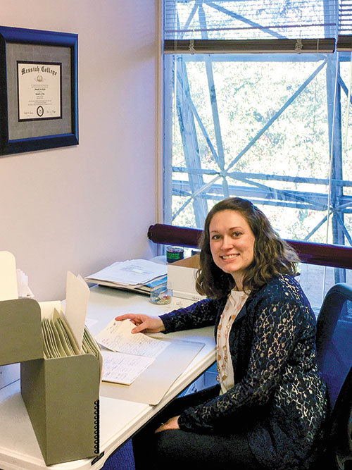 Young woman sitting at desk