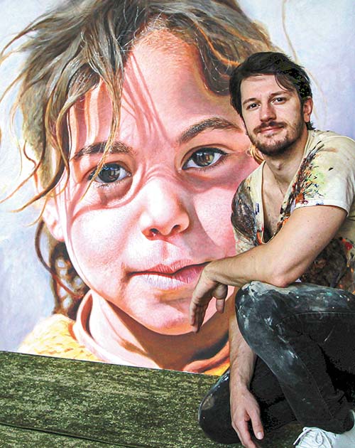 Nick Sider and painting of young refugee