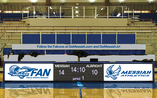 Digital scoreboard displaying the score of a basketball game between Messiah and Albright.