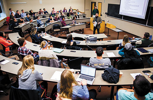 Students have a voice on campus. Students in large circular classroom