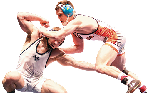 Dynamic action shot of two wrestlers in a competitive match, showcasing strength and technique.