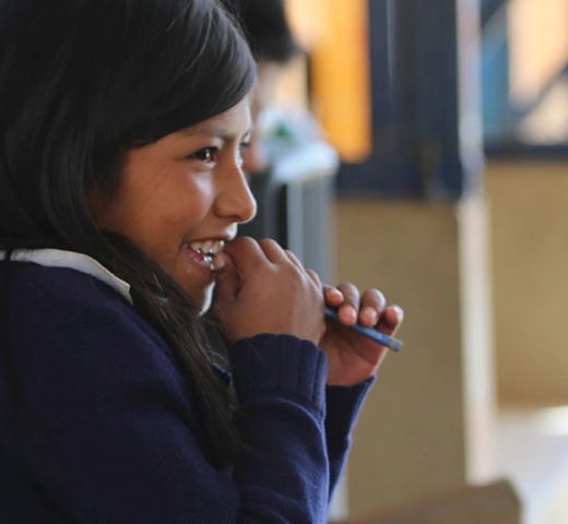 A student talking with a child. 