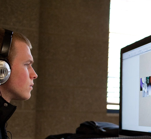 student working on an iMac