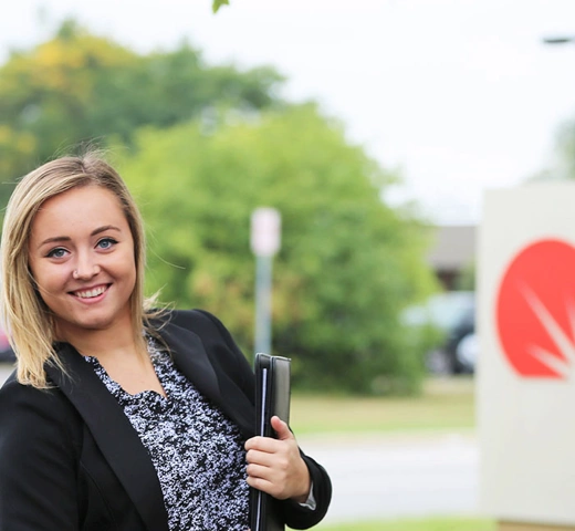 Student in front of a Christianity Today sign. 