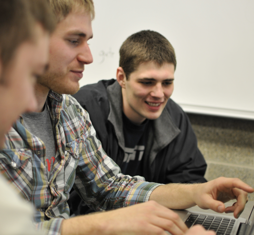 Student on a computer looking at codes